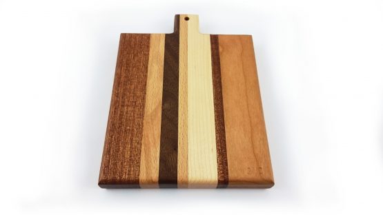 Chopping and serving board constructed from various widths of different hardwood timbers to create an attractive stripped pattern cutting surface. With rounded over edges for easy lifting.